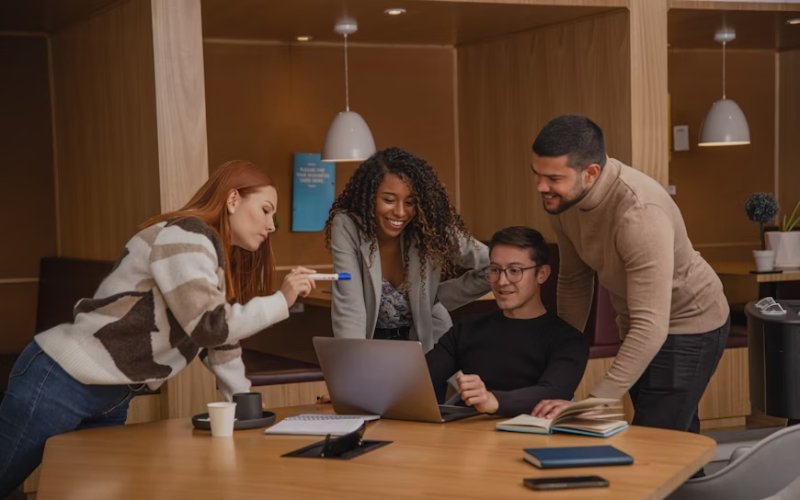 A team of people working collaboratively in an office.